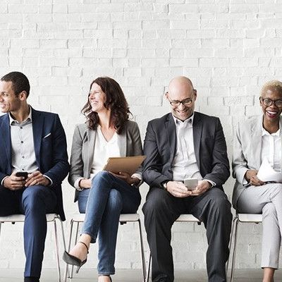 group of people sitting in chairs